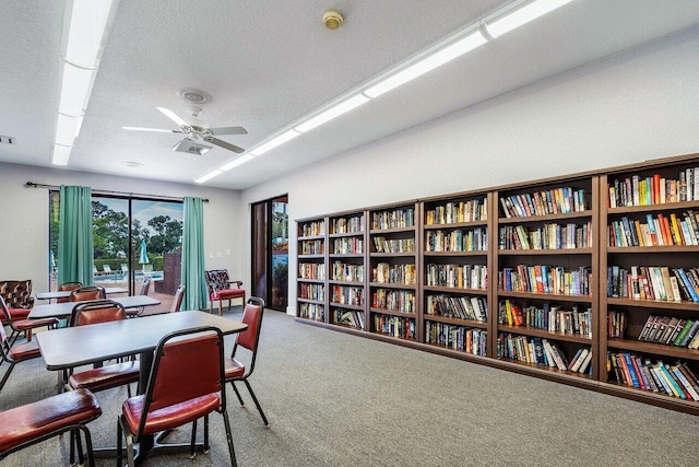 14721 Bonaire Blvd Unit 101, Delray Beach, FL 33446 - carpeted dining area featuring a ceiling fan and a textured ceiling