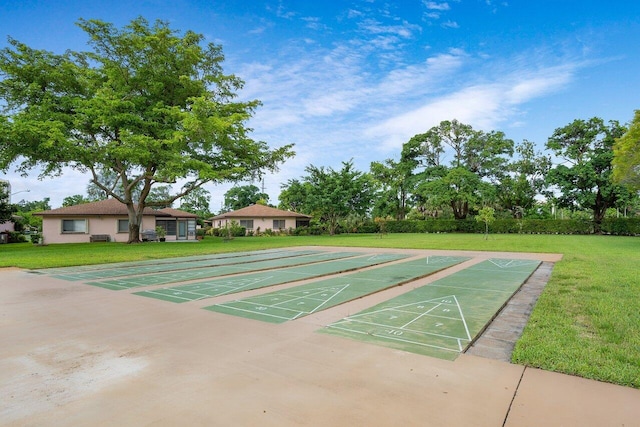 14721 Bonaire Blvd Unit 101, Delray Beach, FL 33446 - view of community featuring a yard, shuffleboard, and uncovered parking