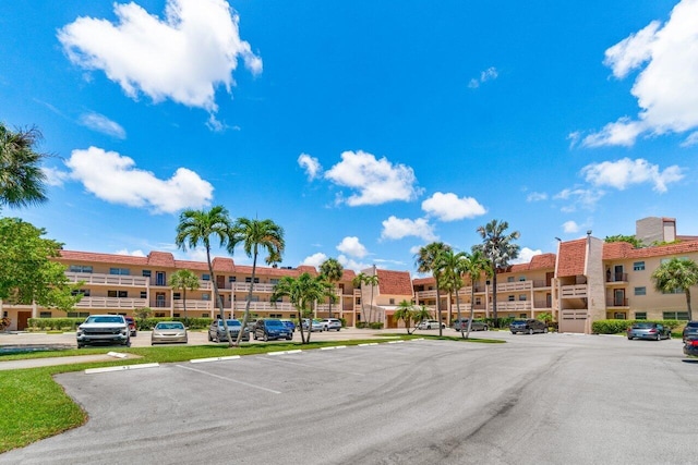 14721 Bonaire Blvd Unit 101, Delray Beach, FL 33446 - view of building exterior featuring uncovered parking