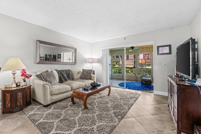 14721 Bonaire Blvd Unit 101, Delray Beach, FL 33446 - living area featuring a textured ceiling, tile patterned floors, and a ceiling fan