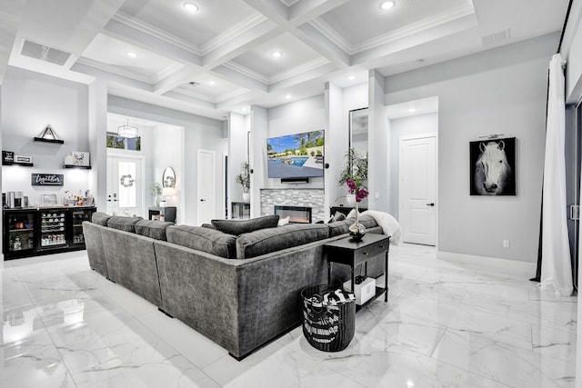 5476 NW Cambo Ct, Port Saint Lucie, FL 34986 - living area with a towering ceiling, a bar, beam ceiling, a stone fireplace, and light marble finish floors