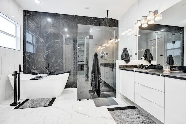 5476 NW Cambo Ct, Port Saint Lucie, FL 34986 - bathroom with tile walls, a marble finish shower, vanity, a soaking tub, and marble tiled flooring