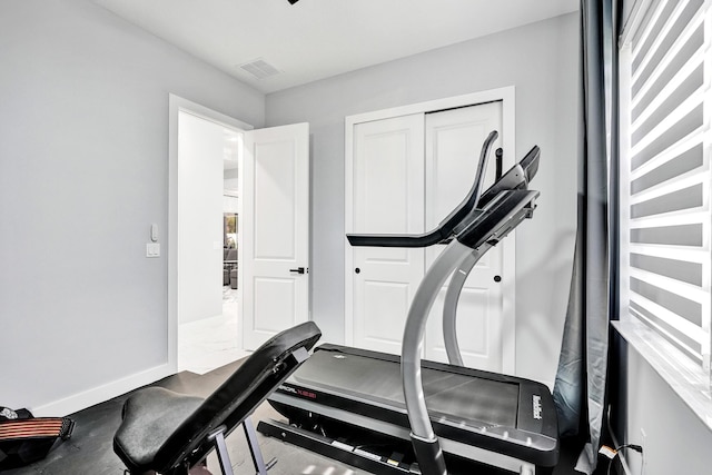 5476 NW Cambo Ct, Port Saint Lucie, FL 34986 - workout area featuring baseboards