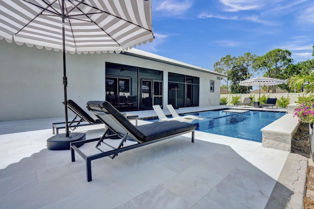 5476 NW Cambo Ct, Port Saint Lucie, FL 34986 - view of swimming pool featuring a patio and a sunroom