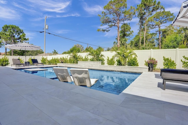 5476 NW Cambo Ct, Port Saint Lucie, FL 34986 - view of pool with a fenced backyard, a patio area, and an in-ground hot tub