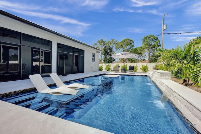 5476 NW Cambo Ct, Port Saint Lucie, FL 34986 - view of swimming pool with a fenced backyard, ceiling fan, a sunroom, and a patio area