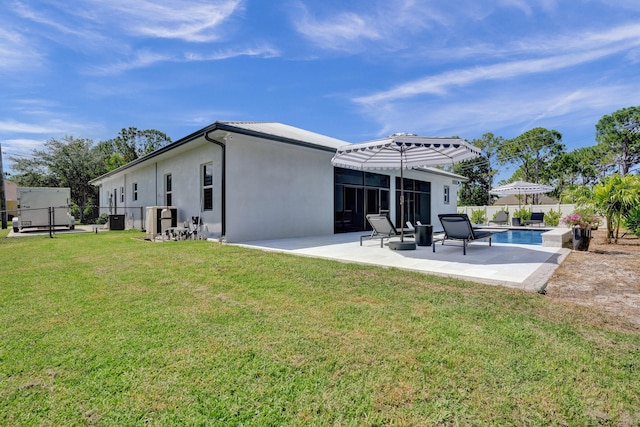 5476 NW Cambo Ct, Port Saint Lucie, FL 34986 - back of property with stucco siding, a fenced backyard, and a patio area