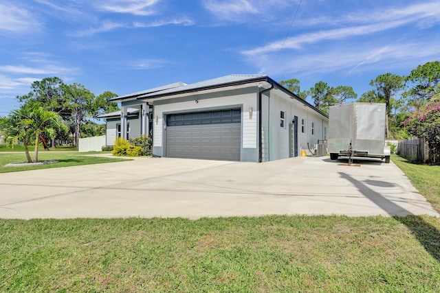 5476 NW Cambo Ct, Port Saint Lucie, FL 34986 - view of front facade with concrete driveway and a garage