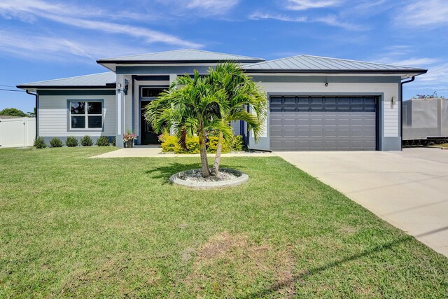 5476 NW Cambo Ct, Port Saint Lucie, FL 34986 - ranch-style house featuring concrete driveway, a garage, a metal roof, and a standing seam roof