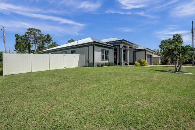 5476 NW Cambo Ct, Port Saint Lucie, FL 34986 - view of front facade featuring a garage and a metal roof