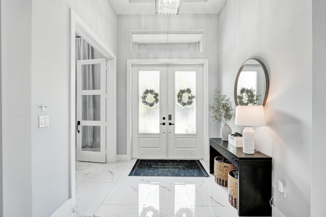 5476 NW Cambo Ct, Port Saint Lucie, FL 34986 - entryway featuring french doors and marble tiled floors