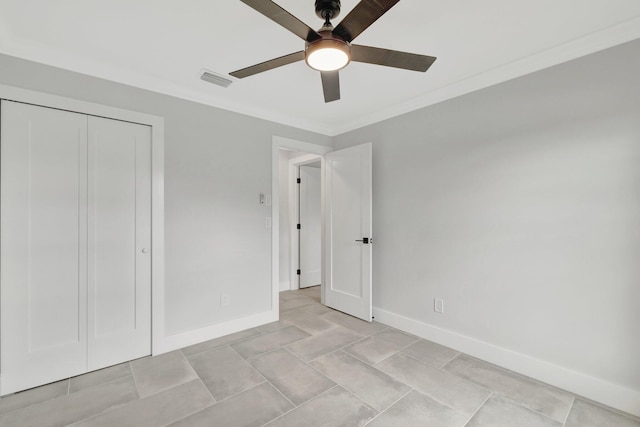 208 SW Langfield Ave, Port Saint Lucie, FL 34984 - unfurnished bedroom featuring crown molding, a closet, ceiling fan, and light tile patterned flooring