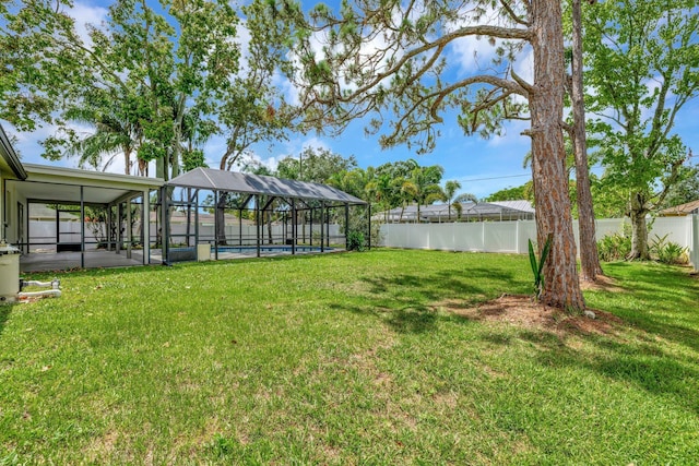 208 SW Langfield Ave, Port Saint Lucie, FL 34984 - fenced backyard featuring a lanai