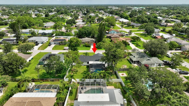 208 SW Langfield Ave, Port Saint Lucie, FL 34984 - aerial perspective of suburban area with a pool