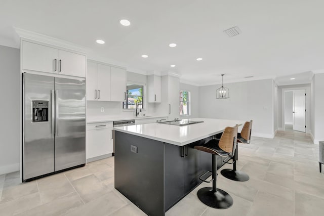 208 SW Langfield Ave, Port Saint Lucie, FL 34984 - kitchen with stainless steel fridge with ice dispenser, ornamental molding, a center island, white cabinets, and light countertops
