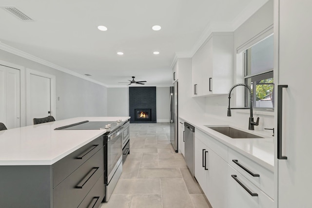 208 SW Langfield Ave, Port Saint Lucie, FL 34984 - kitchen featuring stainless steel appliances, recessed lighting, gray cabinetry, light countertops, and ceiling fan