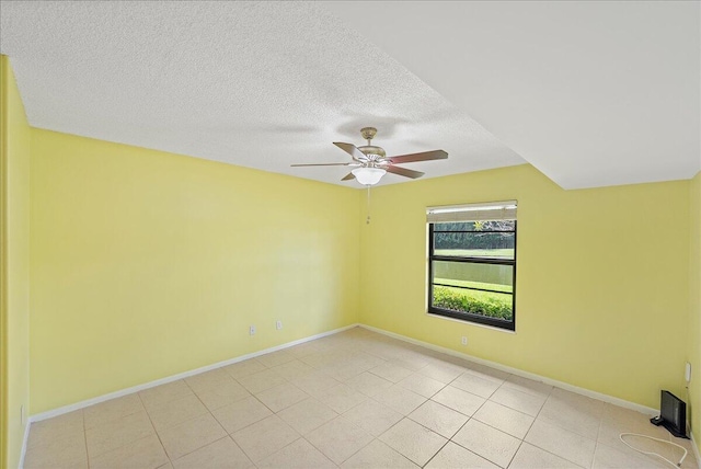 14 Plantation Dr Unit 105, Vero Beach, FL 32966 - empty room with ceiling fan, light tile patterned floors, and a textured ceiling
