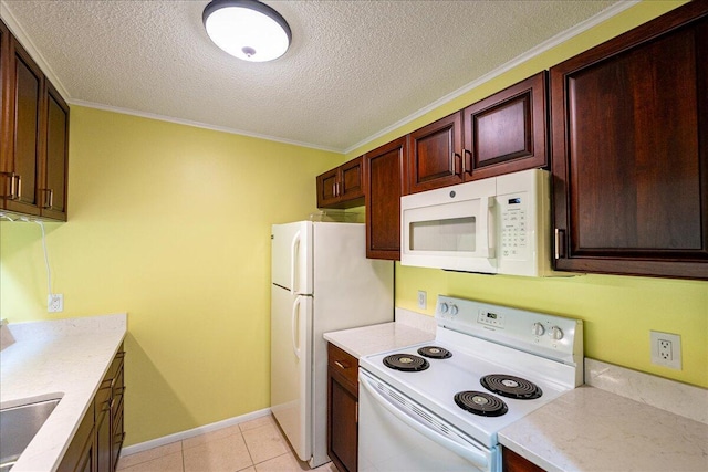 14 Plantation Dr Unit 105, Vero Beach, FL 32966 - kitchen with white appliances, light countertops, a textured ceiling, crown molding, and light tile patterned floors