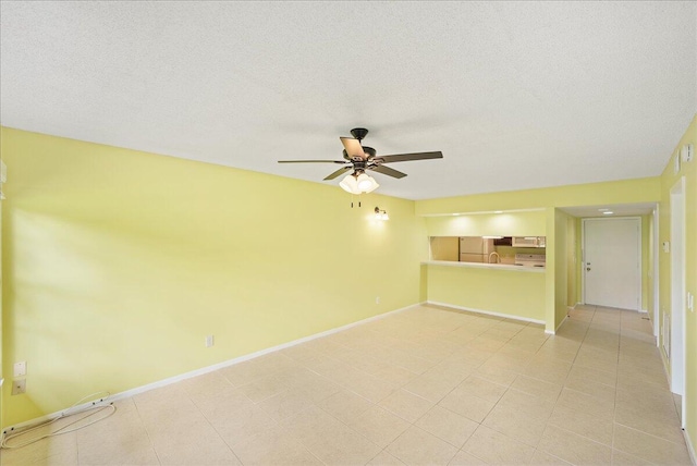 14 Plantation Dr Unit 105, Vero Beach, FL 32966 - unfurnished living room featuring a ceiling fan and a textured ceiling