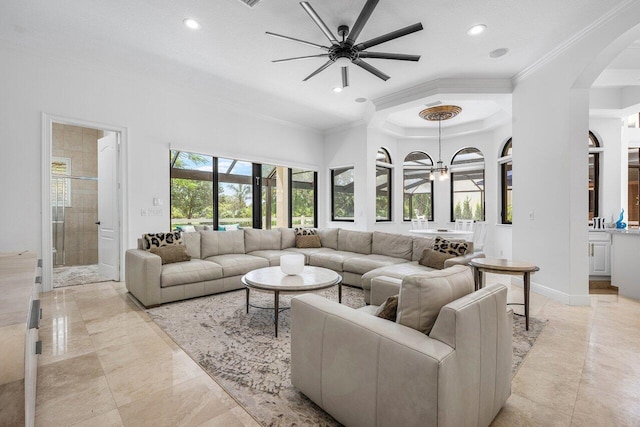 8984 Three Rail Dr, Boynton Beach, FL 33472 - living room with ornamental molding, arched walkways, recessed lighting, a ceiling fan, and a chandelier
