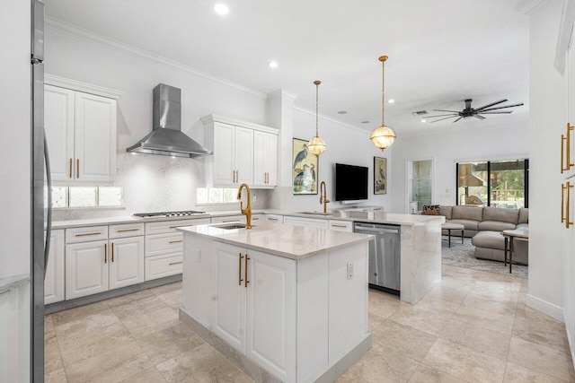 8984 Three Rail Dr, Boynton Beach, FL 33472 - kitchen with appliances with stainless steel finishes, wall chimney range hood, a kitchen island with sink, open floor plan, and white cabinetry