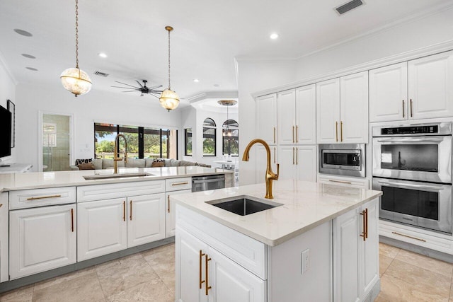 8984 Three Rail Dr, Boynton Beach, FL 33472 - kitchen with stainless steel appliances, crown molding, recessed lighting, open floor plan, and ceiling fan