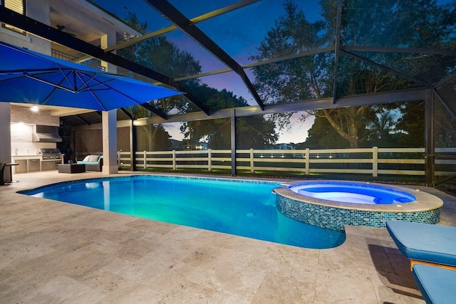 8984 Three Rail Dr, Boynton Beach, FL 33472 - view of pool featuring exterior kitchen, a patio, glass enclosure, and a pool with connected hot tub