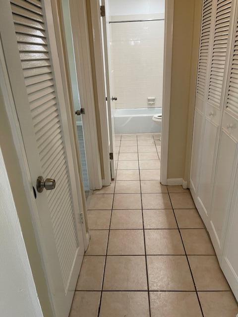 1900 S Kanner Hwy Unit 5-206, Stuart, FL 34994 - corridor with light tile patterned floors
