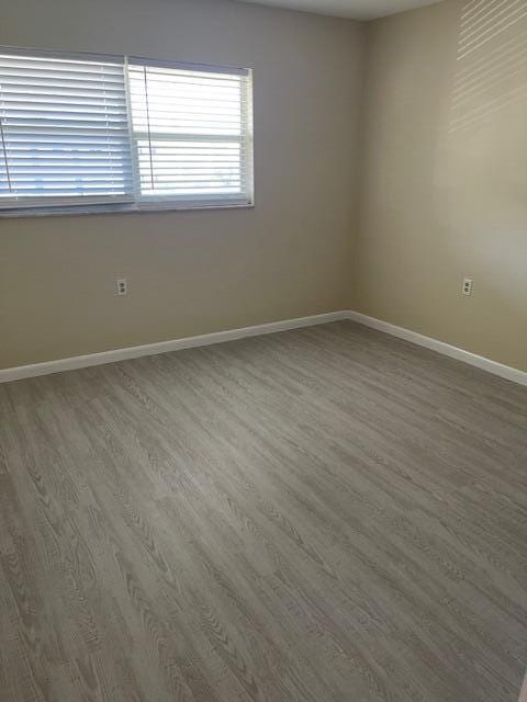 1900 S Kanner Hwy Unit 5-206, Stuart, FL 34994 - spare room with wood finished floors and baseboards