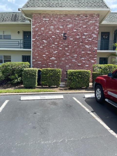 1900 S Kanner Hwy Unit 5-206, Stuart, FL 34994 - view of building exterior featuring uncovered parking