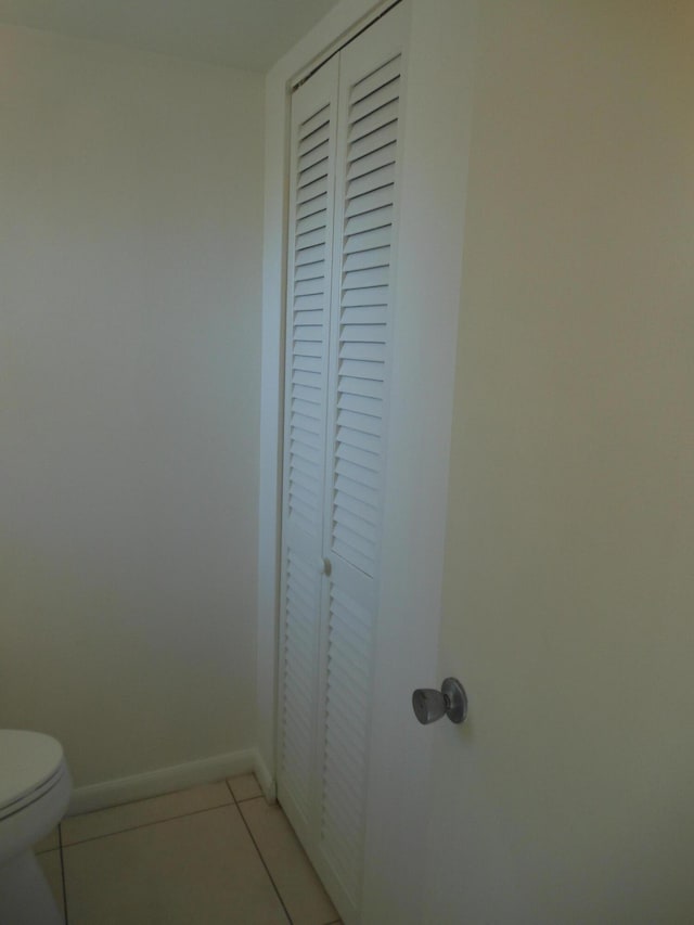 2515 NE 1st Ct Unit 117, Boynton Beach, FL 33435 - bathroom with a closet and tile patterned floors