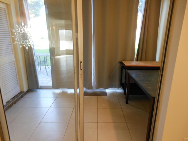 2515 NE 1st Ct Unit 117, Boynton Beach, FL 33435 - hallway featuring light tile patterned flooring
