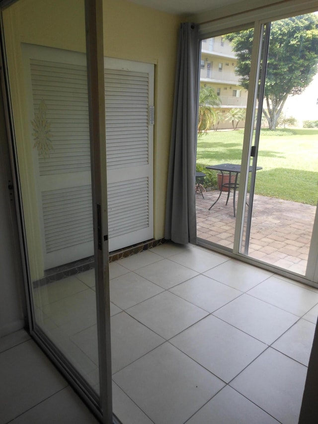 2515 NE 1st Ct Unit 117, Boynton Beach, FL 33435 - doorway to outside featuring light tile patterned floors
