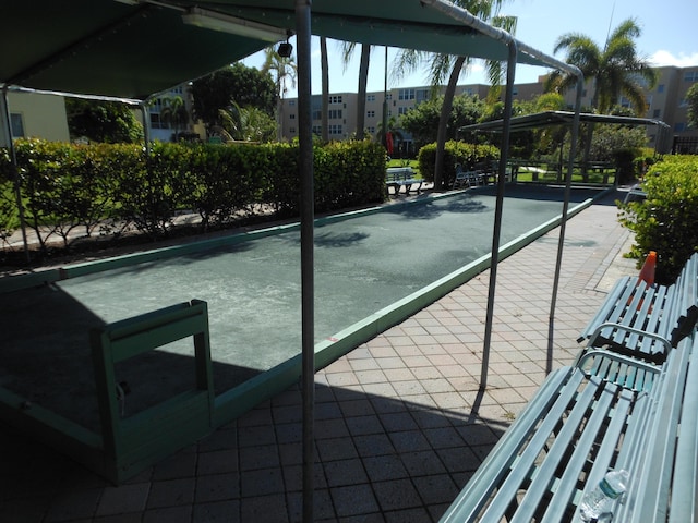 2515 NE 1st Ct Unit 117, Boynton Beach, FL 33435 - view of tennis court with a bocce ball area