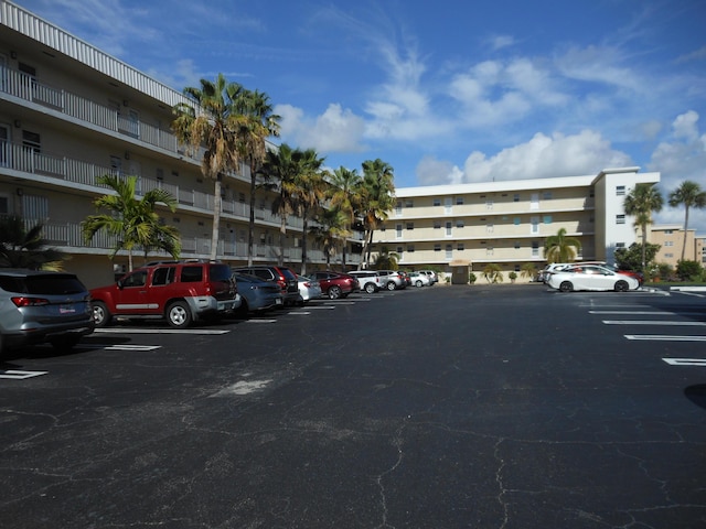 2515 NE 1st Ct Unit 117, Boynton Beach, FL 33435 - view of apartment building / complex featuring uncovered parking