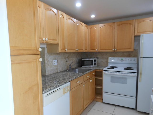 2515 NE 1st Ct Unit 117, Boynton Beach, FL 33435 - kitchen featuring white appliances, light tile patterned floors, tasteful backsplash, stone counters, and recessed lighting