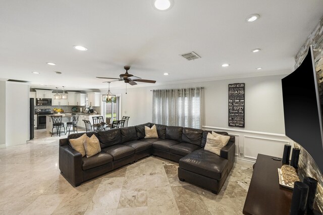 1571 SW Delos Ave, Port Saint Lucie, FL 34953 - living area with a ceiling fan, crown molding, and recessed lighting