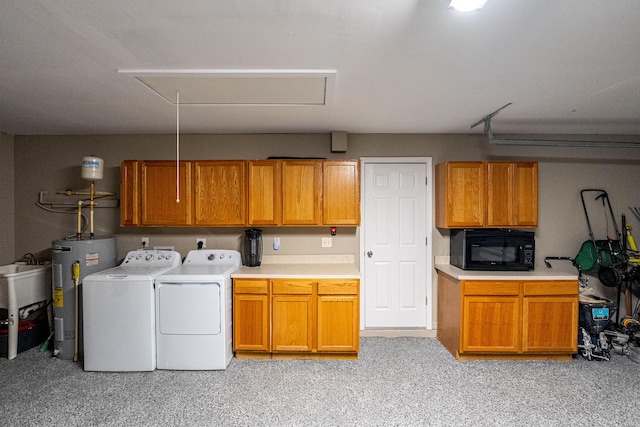 1571 SW Delos Ave, Port Saint Lucie, FL 34953 - laundry room featuring water heater, independent washer and dryer, attic access, cabinet space, and light colored carpet