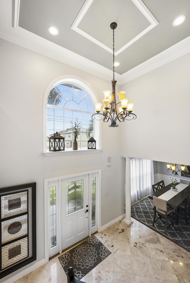1571 SW Delos Ave, Port Saint Lucie, FL 34953 - foyer featuring a chandelier, a tray ceiling, recessed lighting, ornamental molding, and a high ceiling