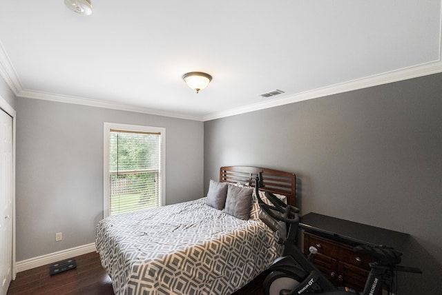 1571 SW Delos Ave, Port Saint Lucie, FL 34953 - bedroom featuring dark wood-style flooring and ornamental molding