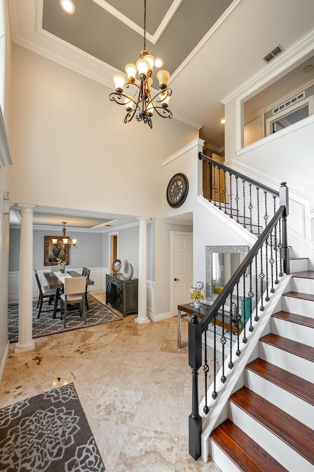 1571 SW Delos Ave, Port Saint Lucie, FL 34953 - foyer with a chandelier, decorative columns, a towering ceiling, ornamental molding, and stairway