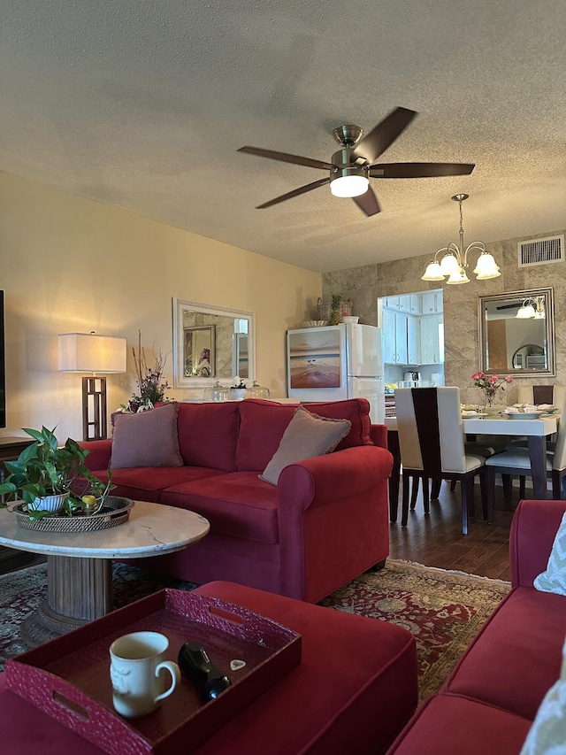 1957 SW Palm City Rd Unit B, Stuart, FL 34994 - living area with a chandelier, a textured ceiling, wood finished floors, and a ceiling fan