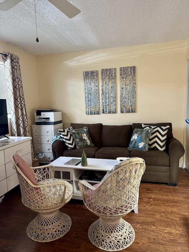 1957 SW Palm City Rd Unit B, Stuart, FL 34994 - living room featuring wood finished floors, a textured ceiling, and ceiling fan