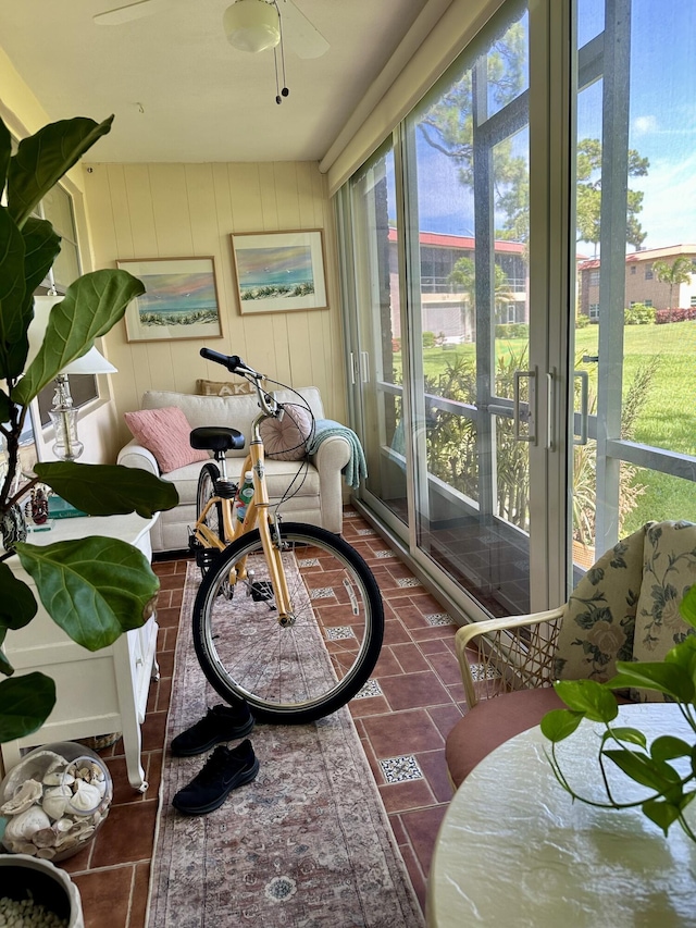 1957 SW Palm City Rd Unit B, Stuart, FL 34994 - sunroom / solarium with a ceiling fan and tile patterned floors