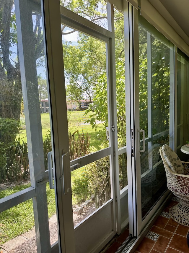 1957 SW Palm City Rd Unit B, Stuart, FL 34994 - doorway featuring dark tile patterned floors