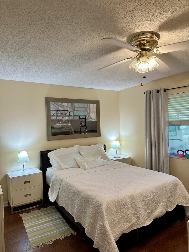 1957 SW Palm City Rd Unit B, Stuart, FL 34994 - bedroom featuring wood finished floors, a textured ceiling, and a ceiling fan