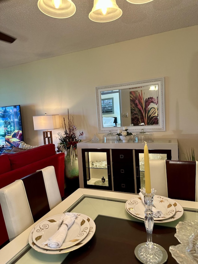 1957 SW Palm City Rd Unit B, Stuart, FL 34994 - dining space featuring a textured ceiling