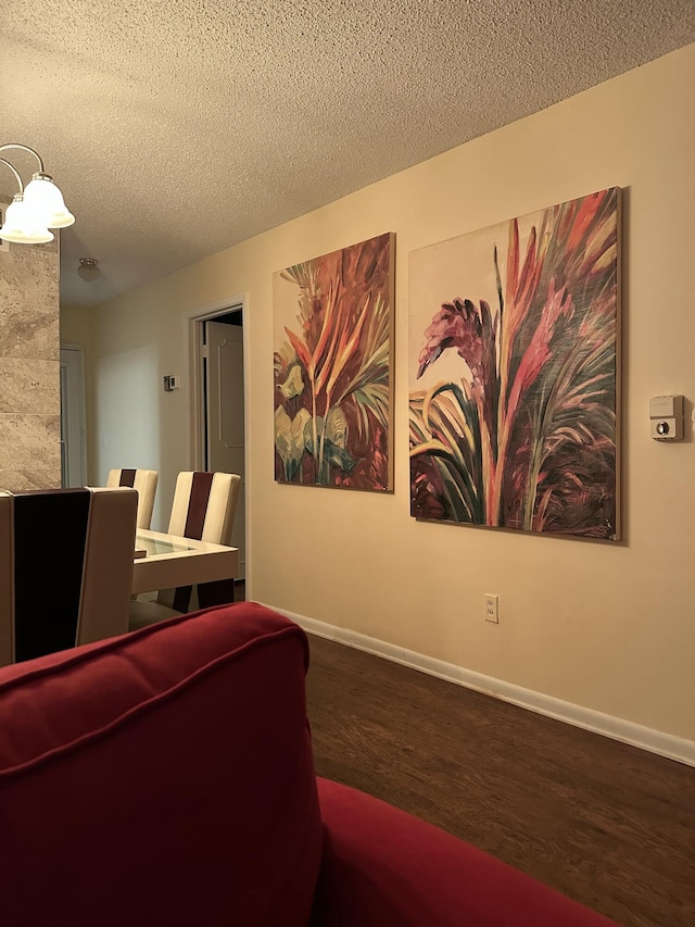 1957 SW Palm City Rd Unit B, Stuart, FL 34994 - living area featuring a textured ceiling and wood finished floors
