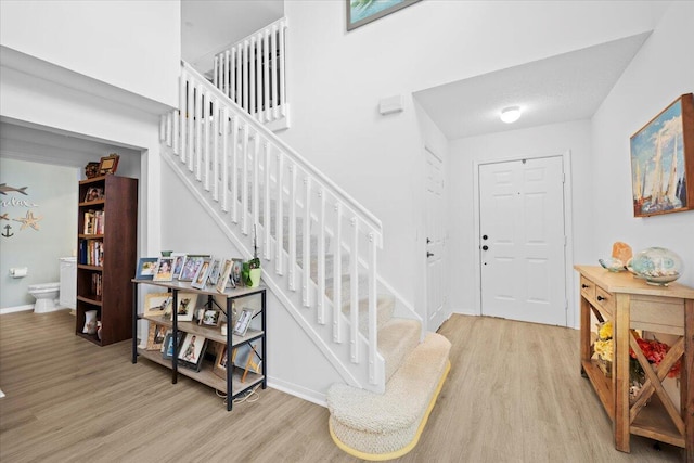 1047 Via Jardin, Riviera Beach, FL 33418 - foyer featuring wood finished floors and stairs