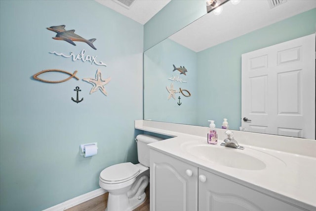 1047 Via Jardin, Riviera Beach, FL 33418 - bathroom featuring vanity and wood finished floors